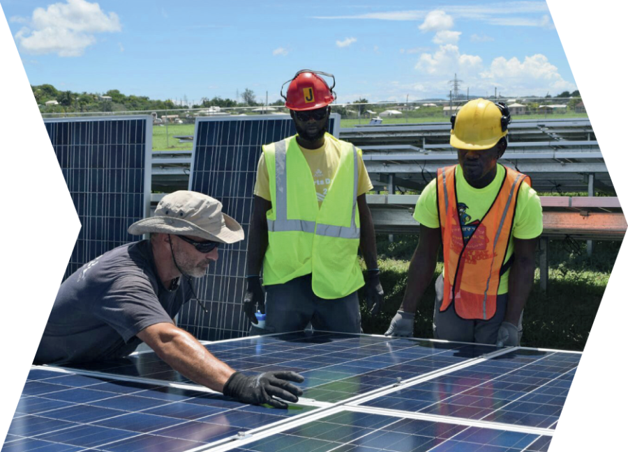 Workers installing solar panels at the airport solar park Antigua.