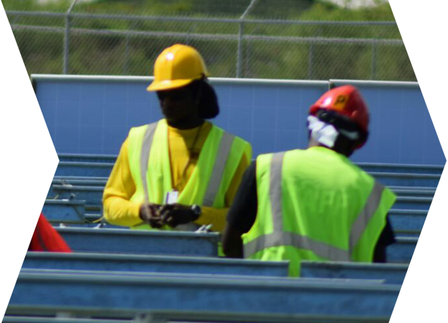 Two workers installing the substructures of a solar installation.