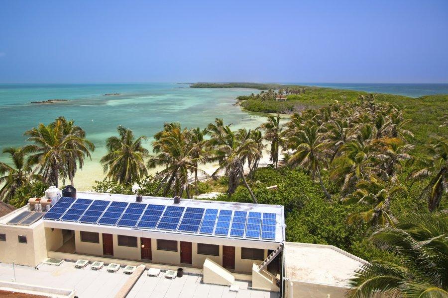 A small house equipped with a solar installation at the seaside.