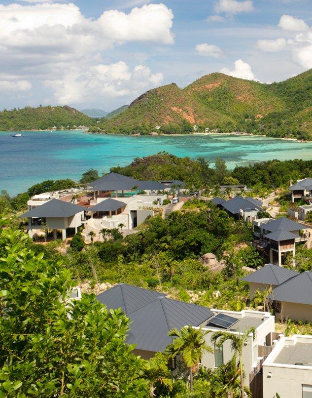 Landscape with small cottages in the Caribbean.