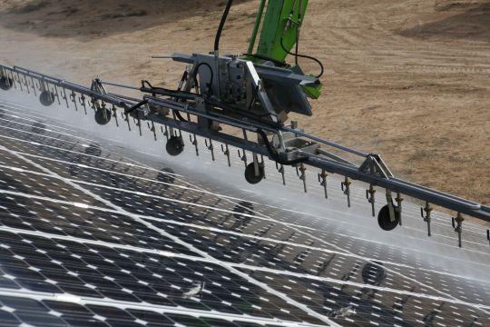 Close-up of the solar panel cleaning procedure.