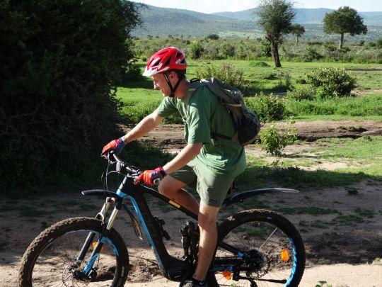 Guest of Safari camp during e-bike ride.